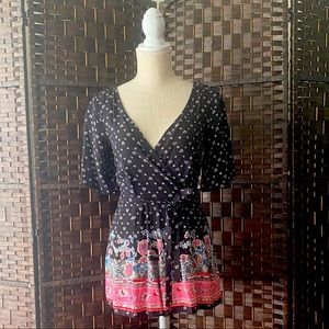 Beautiful romper with back opening detail